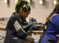 U.S. Army Retired Sgt. 1st Class Valerie Watkins prepares her air rifle during the precision air event at the 2025 Department of Defense Warrior Games in Colorado Springs, Colorado, July 21, 2025.