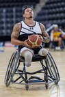 U.S. Army Retired Sgt. Jason Smith warms up before a wheelchair basketball game during the 2025 Department of Defense Warrior Games at Colorado Springs, Colorado, July 20, 2025.