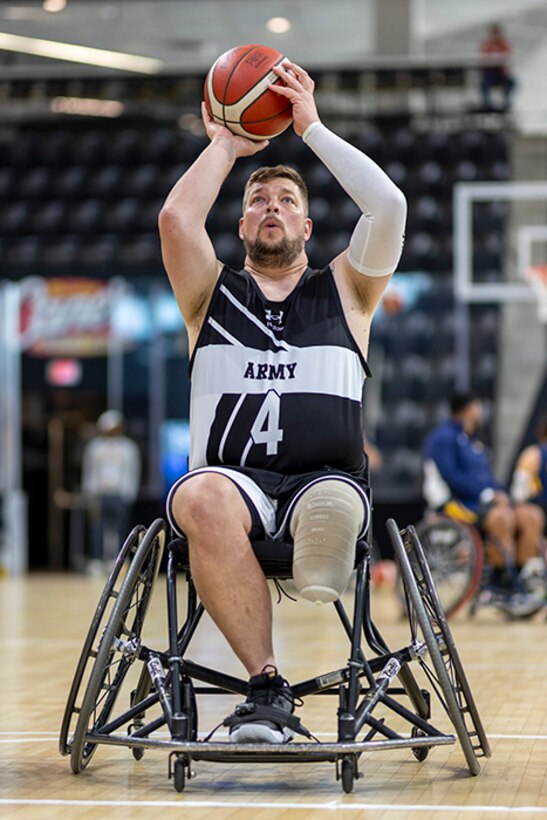 U.S. Army Sgt. 1st Class Adam Proctor warms up before a wheelchair basketball game during the 2025 Department of Defense Warrior Games at Colorado Springs, Colorado, July 20, 2025.