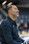 U.S. Army Capt. Carlos Rivera smiles at a teammate during warm-ups before a wheelchair basketball game at the 2025 Department of Defense Warrior Games at Colorado Springs, Colorado, July 20, 2025.