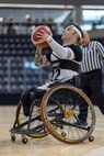 U.S. Army Retired Spc. JP Lane shoots the ball in the wheelchair basketball game against Team Navy during the 2025 Department of Defense Warrior Games at Colorado Springs, Colorado, July 20, 2025.