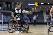 U.S. Army Retired Spc. JP Lane shouts out directions to teammates in the wheelchair basketball game against Team Navy during the 2025 Department of Defense Warrior Games at Colorado Springs, Colorado, July 20, 2025.