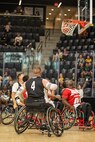 U.S. Army Sgt. 1st Class Adam Proctor scores during a wheelchair basketball game against Team Marine Corps at the 2025 Department of Defense Warrior Games in Ed Robson Arena, Colorado Springs, Colorado, July 19, 2025.