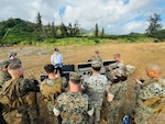 U.S. Naval Research Laboratory Principal Investigator Kevin Cronin (left) and U.S. Marine Corps Expeditionary Energy Office Science and Technology Analyst Capt. Joshua Ashley (right) train Marines with Combat Logistics Company 33 on the warfighting utility of hydrogen fuel cell systems during an exercise at Marine Corps Training Area Bellows, Hawaii, March 4, 2024.