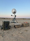 The U.S. Naval Research Laboratory (NRL) developed Hydrogen Small Unit Power (H-SUP) powering communications equipment during field testing at Marine Corps Air Ground Combat Center Twentynine Palms, Cali., May 19, 2025. The H-SUP system is a portable fuel cell electric generator with greater energy per weight than batteries and lower audible and thermal signatures than combustion generators.