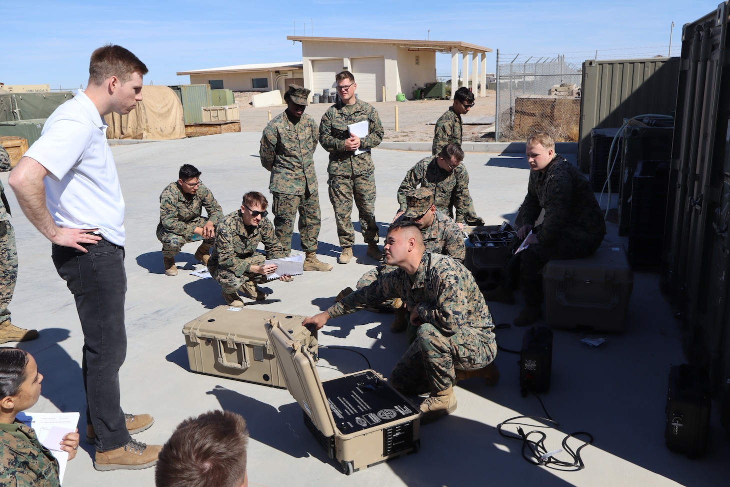 U.S. Naval Research Laboratory Principal Investigator Kevin Cronin (left) trains Marines from Marine Wing Support Squadron 371 on the operation of the Hydrogen Small Unit Power (H-SUP) at Marine Corps Air Station Yuma, Arizona, Feb. 19, 2025. (U.S. Navy photo)