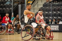 U.S. Army Retired Spc. Anthony Farve executes a clever move during a wheelchair basketball game against Team Marine Corps at the 2025 Department of Defense Warrior Games in Ed Robson Arena, Colorado Springs, Colorado, July 19, 2025.