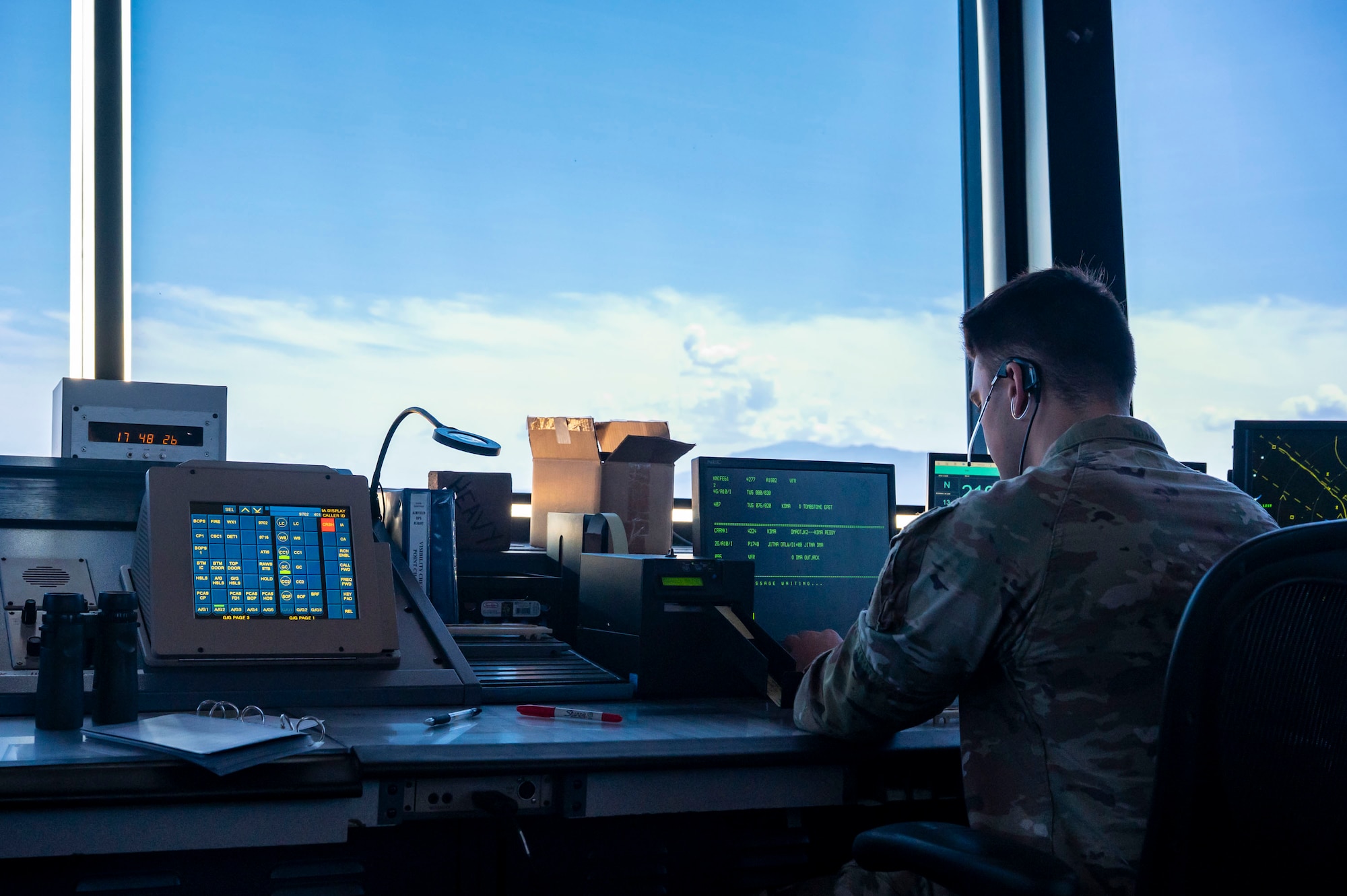 U.S. Air Force Airman 1st Class Maxwell Vincent, 563rd Operational Support Squadron air traffic control journeyman, ensures the safe, orderly and expeditious flow of air traffic at Davis-Monthan Air Force Base, Arizona, July 23, 2025. Controllers manage the flow of military aircraft to ensure mission efficiency and the safety of aircrews in dynamic and often high-tempo environments. (U.S. Air Force photo by Airman Samantha Melecio)