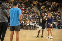 U.S. Army Staff Sgt. Allaijah Churchwell gives an interview during halftime of the wheelchair basketball gold medal game at the 2025 Department of Defense Warrior Games in Ed Robson Arena, Colorado Springs, Colorado, July 20, 2025.
