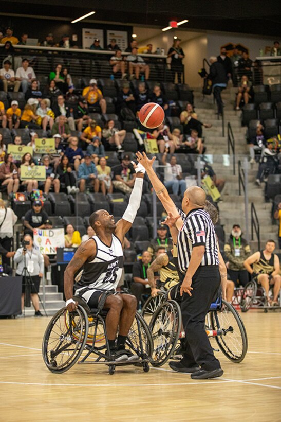 U.S. Army Staff Sgt. Derrick Thompson is at center circle for the tip-off of the wheelchair basketball gold medal game at the 2025 Department of Defense Warrior Games in Ed Robson Arena, Colorado Springs, Colorado, July 20, 2025.