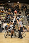 U.S. Army Staff Sgt. Derrick Thompson is at center circle for the tip-off of the wheelchair basketball gold medal game at the 2025 Department of Defense Warrior Games in Ed Robson Arena, Colorado Springs, Colorado, July 20, 2025.