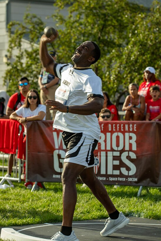 U.S. Army Master Sgt. Earlie Brown launches the shot put during the field event at the 2025 Department of Defense Warrior Games in Colorado Springs, Colorado, July 22, 2025.