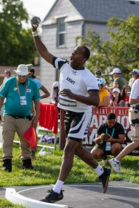 U.S. Army Staff Sgt. Derrick Thompson launches the shot put during the field event at the 2025 Department of Defense Warrior Games in Colorado Springs, Colorado, July 22, 2025.