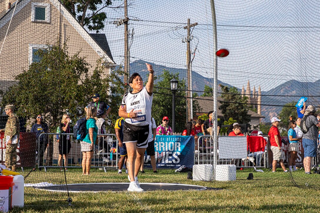 U.S. Army Chief Warrant Officer 4 Joann Tsuhako throws the discus during the field event at the 2025 Department of Defense Warrior Games in Colorado Springs, Colorado, July 22, 2025.