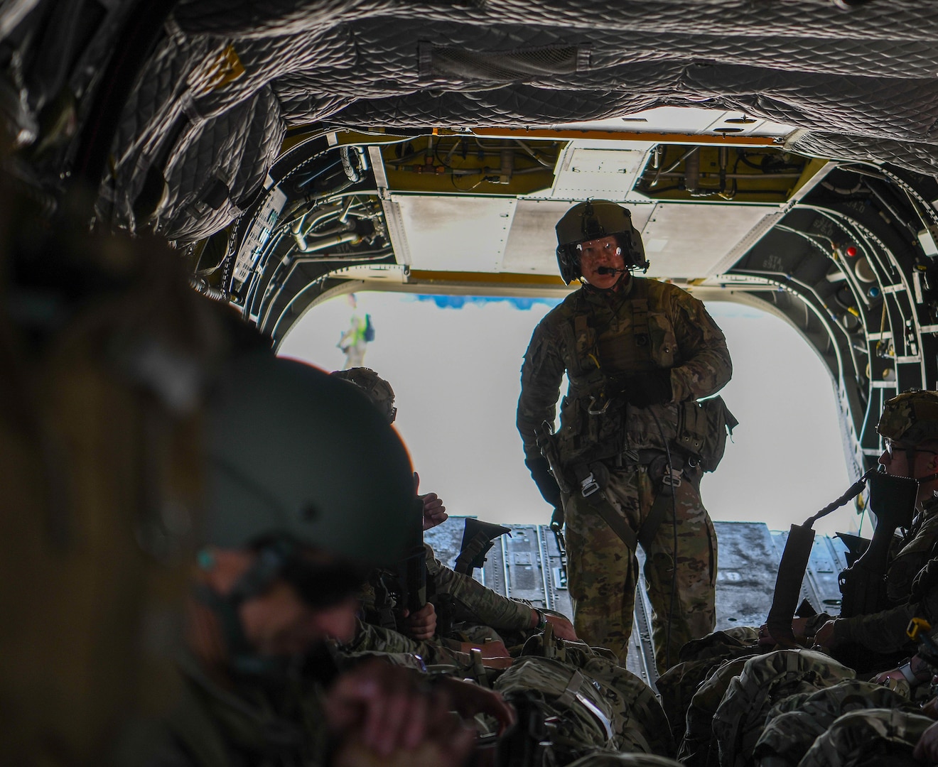 An Ohio National Guard CH-47 Chinook helicopter repairer assigned to Company B, 3rd Battalion, 238th Aviation Regiment, does in-flight inspections during a flight to Wright-Patterson Air Force Base, Ohio, July 14, 2025.