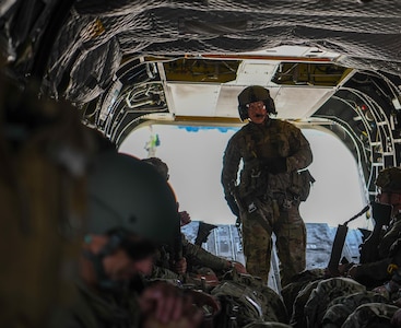 An Ohio National Guard CH-47 Chinook helicopter repairer assigned to Company B, 3rd Battalion, 238th Aviation Regiment, does in-flight inspections during a flight to Wright-Patterson Air Force Base, Ohio, July 14, 2025.