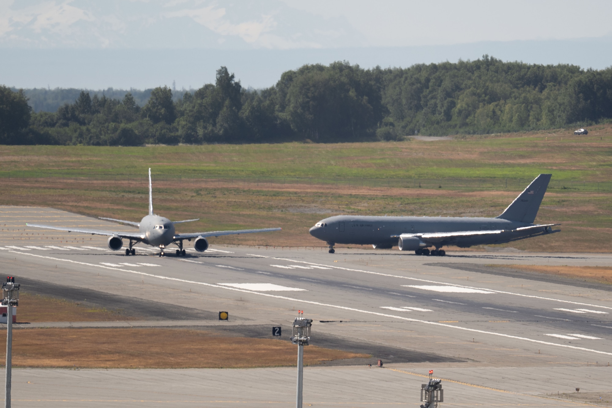 Aircraft taxi the runway.