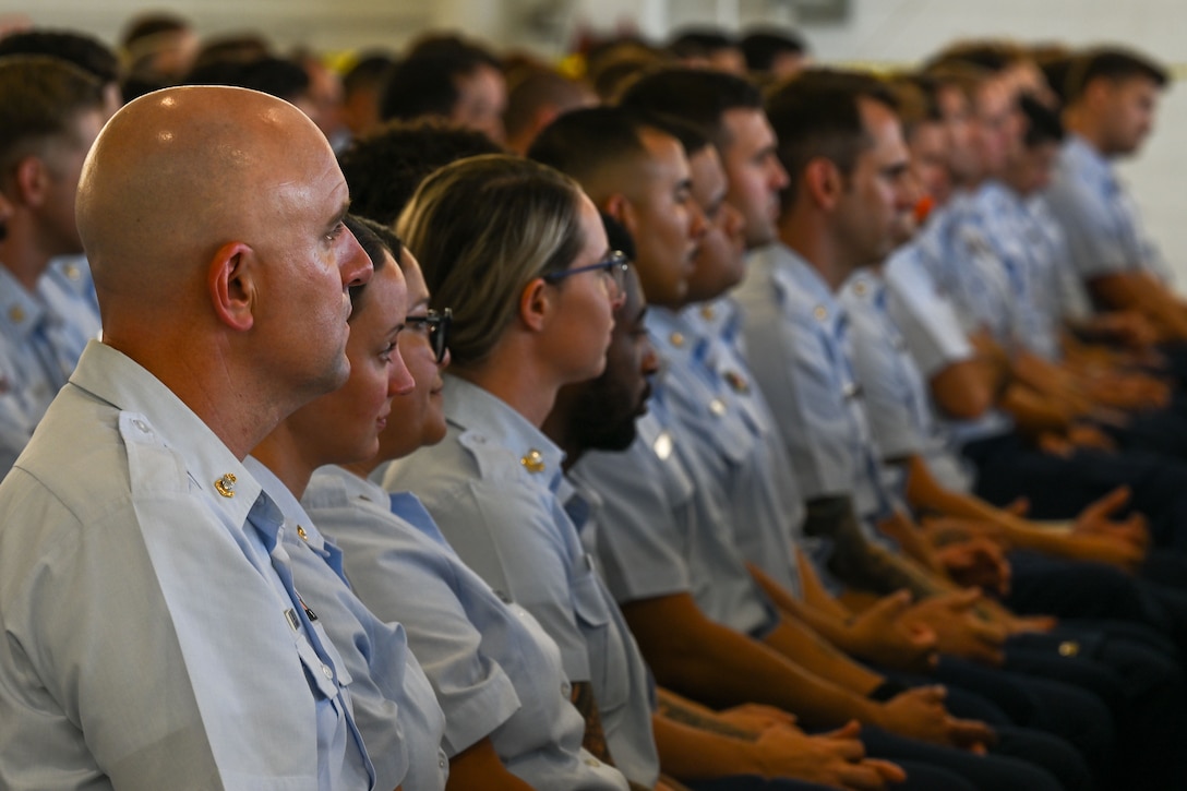 U.S. Coast Guard Air Station Clearwater members attend a change of command ceremony in Clearwater, Florida, July 24, 2025. Air Station Clearwater is composed of more than 400 active duty, reserve, Auxiliary and civilian personnel, who provide critical mission support to the Southeast District.  (U.S. Coast Guard photo by Petty Officer 1st Class Riley Perkofski)