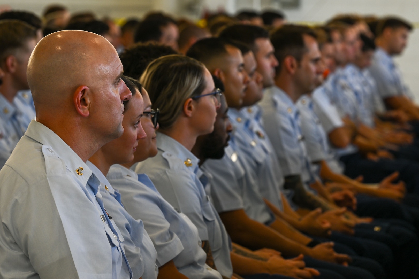 U.S. Coast Guard Air Station Clearwater members attend a change of command ceremony in Clearwater, Florida, July 24, 2025. Air Station Clearwater is composed of more than 400 active duty, reserve, Auxiliary and civilian personnel, who provide critical mission support to the Southeast District.  (U.S. Coast Guard photo by Petty Officer 1st Class Riley Perkofski)