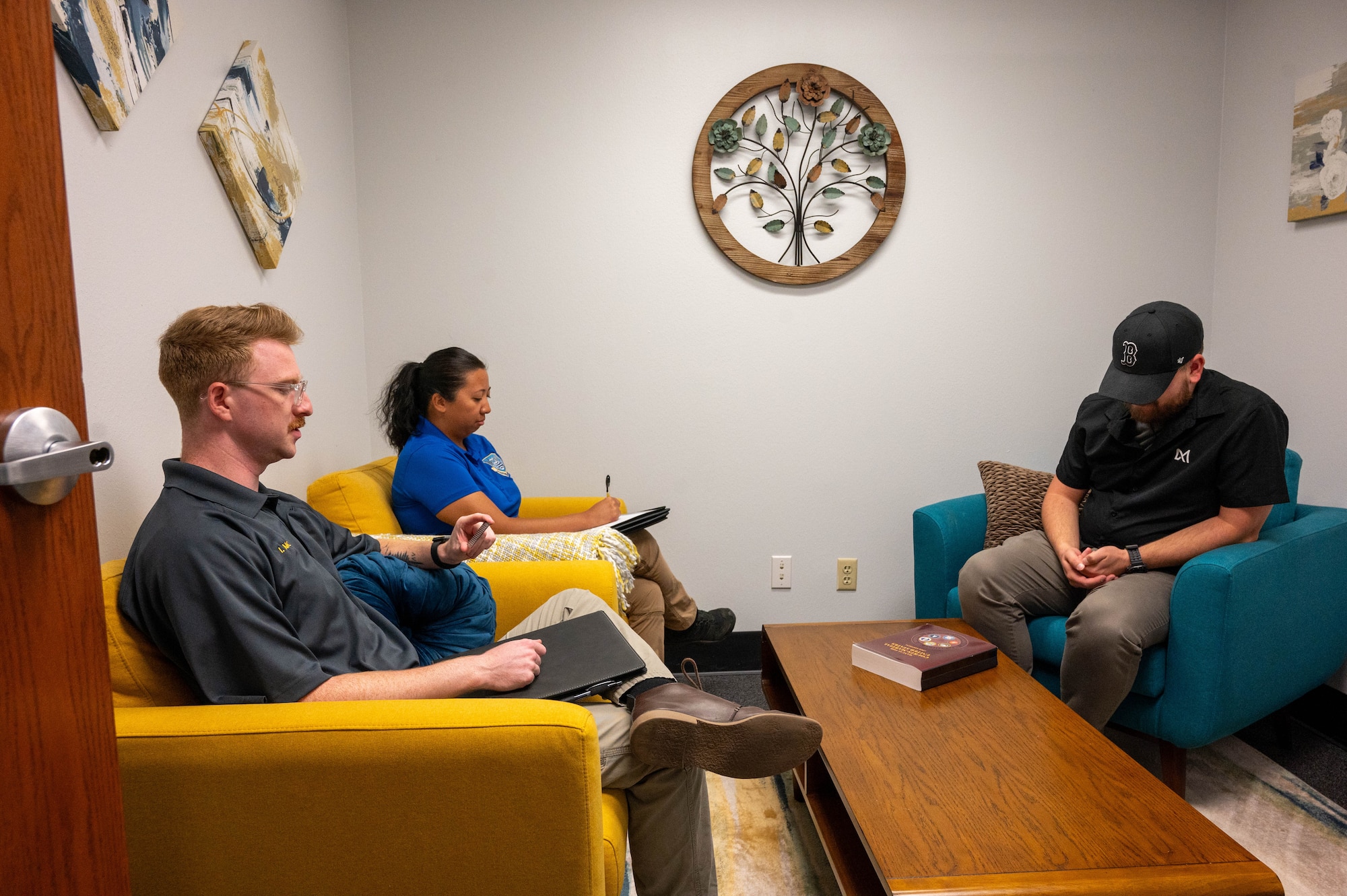 Special Agent Isaiah Moore, assigned to the Air Force Office of Special Investigations (AFOSI) Detachment 422, left, and Special Agent Katrina Cortez, assigned to Det. 422, interview a subject, right, at Altus Air Force Base, Oklahoma, July 22, 2025. The AFOSI mission is to identify, exploit and neutralize criminal, terrorist, and intelligence threats to the Department of the Air Force and the U.S. government. (U.S. Air Force photo by Senior Airman Kari Degraffenreed)