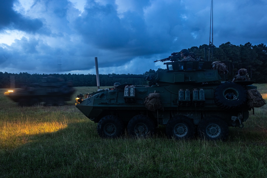 U.S. Marines with 22nd Marine Expeditionary Unit patrol to an observation post during an amphibious assault as part of Composite Training Unit Exercise on Marine Corps Base Camp Lejeune, North Carolina, July 9, 2025. During COMPTUEX, the Iwo Jima Amphibious Ready Group and 22nd MEU(SOC), refine tactics, techniques, and procedures to execute warfighting functions that enhance operational readiness and lethality as a unified IWOARG/22 MEU(SOC) team.