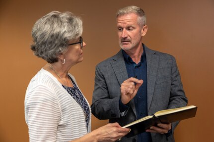 Stede Harwood, U.S. Army Financial Management Command financial management systems analyst, right, coordinates with Kim Hood, USAFMCOM deputy chief of staff at the Maj. Gen. Emmett J. Bean Federal Center in Indianapolis July 23, 2025. For his efforts in keeping the Army’s Deployed Disbursing System in balance, Harwood was recently named a U.S. Army Materiel Command employee of the quarter for the first quarter of Fiscal Year 2025. (U.S. Army photo by Mark R. W. Orders-Woempner)