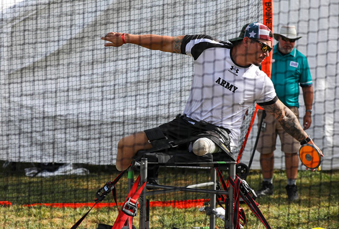 U.S. Army Retired Sgt. Jason Smith prepares to throw the discus during the field event at the 2025 Department of Defense Warrior Games at Colorado Springs, Colorado, July 22, 2025.