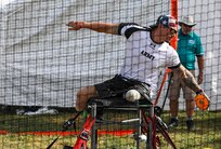 U.S. Army Retired Sgt. Jason Smith prepares to throw the discus during the field event at the 2025 Department of Defense Warrior Games at Colorado Springs, Colorado, July 22, 2025.