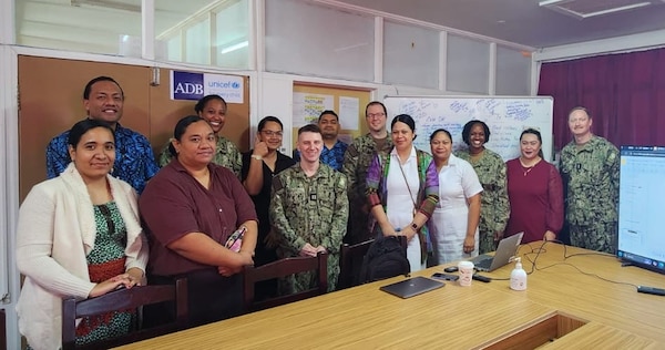 Cmdr. Christina Carter, a Navy public health nurse currently serving as the Director for Public Health at Naval Hospital Twentynine Palms and Navy Medicine Readiness and Training Command Twentynine Palms, participates in a tabletop exercise in the Kingdom of Tonga as part of Pacific Partnership 2025. Alongside Lt. William Douthitt, Lt. j.g. William Chipmon, Lt. Iyanna Alexander, and Hospital Corpsman 3rd Class Camille Erespe, Carter helped facilitate the scenario-based training focused on improving response strategies for a potential Salmonella outbreak. Pacific Partnership is the U.S. Navy’s largest annual humanitarian mission, aimed at strengthening disaster response capabilities, building relationships with host nations, and improving health outcomes through education and collaboration (U.S. Navy Courtesy Photo).