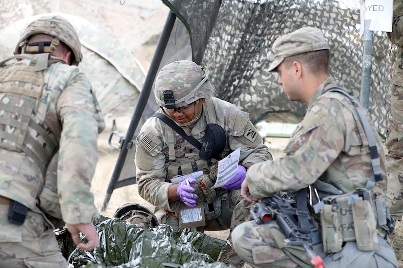 A Soldier, assigned to the 81st Stryker Brigade Combat Team, evaluates a casualty in the triage area of the role 2 medical treatment facility during a mass casualty exercise at Raven Focus, July 19, 2025, at the Yakima Training Center in Washington.
