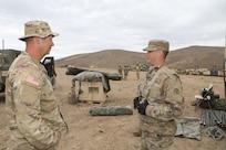 Sgt. 1st Class Jake Brand, right, Observer coach/trainer assigned to the 1-364th Training Support Battalion, 85th U.S. Army Reserve Support Command, discusses current operations with 1st Sgt. Nathan Brogan, assigned to Golf Company, 181st Brigade Support Battalion, Ephrata, Washington, during the Raven Focus exercise in Yakima Training Center, Washington, July 21, 2025.