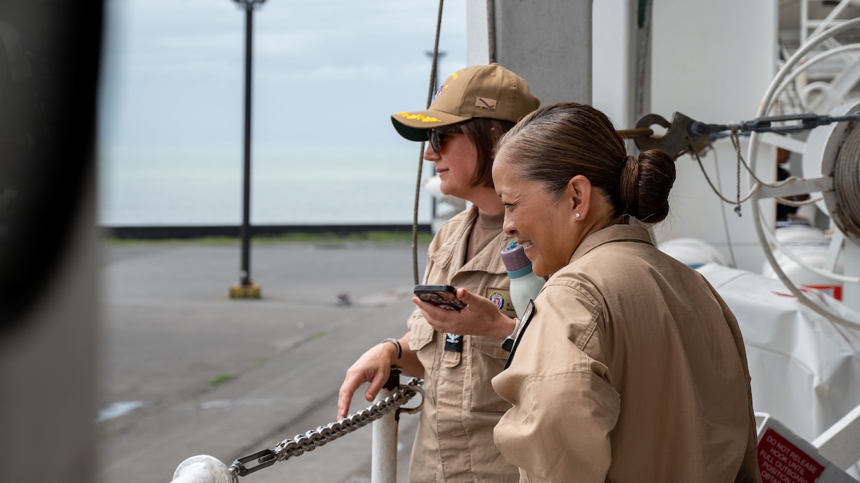 LIMÓN, Costa Rica (July 24, 2025) Capt. Grace Key, commanding officer, USNS Comfort Medical Treatment Facility (MTF), and Capt. Kathryn Stewart, executive officer, USNS Comfort MTF, watch as the Mercy-class hospital ship USNS Comfort (T-AH 20) arrives in Limón, Costa Rica during Continuing Promise 2025, July 24, 2025. Continuing Promise 2025 is the 16th iteration of the U.S. 4th Fleet/U.S. Naval Forces Southern Command-led mission since 2007, which aims to foster goodwill, strengthen existing partnerships with partner nations, and form new partnerships between host nations, non-federal entities, and international organizations. (U.S. Navy photo by Mass Communication Specialist 2nd Class Deven Fernandez)