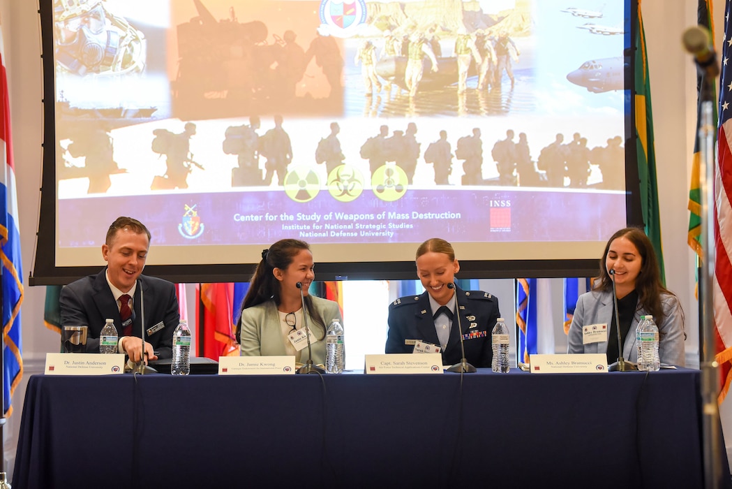 Panel 2 (Working Lunch) at the Annual WMD Symposium titled, "Emerging WMD Researchers."  From left to right: Dr. Justin Anderson, Deputy Director, Center for the Study of WMD, Institute for National Strategic Studies, National Defense University (Moderator); Dr. Jamie Kwong, Fellow, Nuclear Policy Program, Carnegie Endowment for International Peace; Captain Sarah R. Stevenson, USAF, Ph.D., Nuclear Response Officer, Air Force Technical Applications Center, and Project on Nuclear Issues (PONI) Scholar, Center for Strategic and International Studies; Ms. Ashley Bramucci, Assistant Research Fellow, Center for the Study of WMD, Institute for National Strategic Studies, National Defense University.