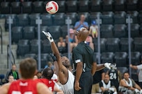 U.S. Army Master Sgt. Earlie Brown stretches for the ball against Team Marine Corps athletes during a wheelchair rugby match at the 2025 Department of Defense Warrior Games at Ed Robson Arena, Colorado Springs, Colorado, July 22, 2025.