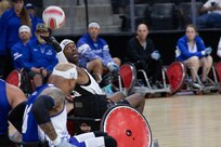 U.S. Army Staff Sgt. Derrick Thompson reaches for the ball during the wheelchair rugby event at the 2025 Department of Defense Warrior Games at Ed Robson Arena in Colorado Springs, Colorado, July 22, 2025