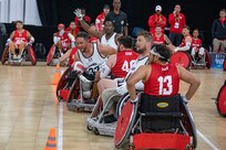 U.S. Army Retired Spc. Anthony Farve fights to score in a wheelchair rugby match during the 2025 Department of Defense Warrior Games at Ed Robson Arena, Colorado Springs, Colorado, July 22, 2025.