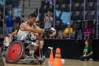 U.S. Army Retired Spc. Anthony Farve scores for Team Army in a wheelchair rugby match during the 2025 Department of Defense Warrior Games at Ed Robson Arena, Colorado Springs, Colorado, July 22, 2025.