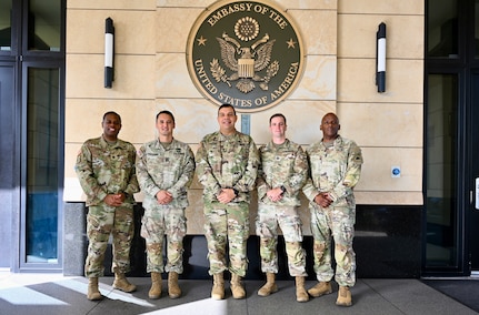 U.S. Army Lt. Col. Angel Lopez Jr., senior defense official/defense attaché; U.S. Army Capt. Chad Pickering, incoming Bilateral Affairs Officer; U.S. Army Maj. Gen. John C. Andonie, Commanding General (Interim) of the D.C. National Guard; U.S. Army Capt. Aaron Lies, outgoing Bilateral Affairs Officer, and U.S. Army Command Sgt. Maj. Ronald L. Smith Jr., Command Senior Enlisted Leader (CSEL) for the DCNG, stand outside the U.S. Embassy in Kingston, Jamaica, on July 18, 2025. Maj. Gen. Andonie and CSM Smith visited Jamaica to discuss ongoing partnerships between the D.C. National Guard and the Jamaica Defense Force.