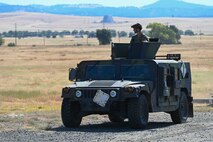 A U.S. Air Force High Mobility Multipurposed Wheeled Vehicle (HMMWV) escorts cargo during an exercise on Beale Air Force Base, California, July 17, 2025.
