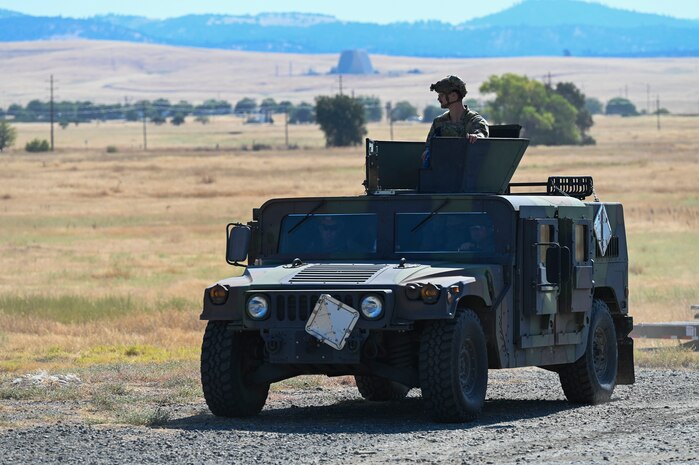 A U.S. Air Force High Mobility Multipurposed Wheeled Vehicle (HMMWV) escorts cargo during an exercise on Beale Air Force Base, California, July 17, 2025.