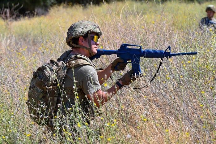 U.S. Air Force Staff Sgt. Bryce Villicana, 9th Civil Engineer Squadron scheduler, provides cover during an exercise on Beale Air Force Base, California, July 17, 2025.