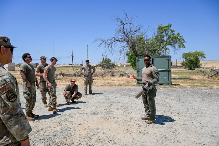 U.S. Air Force Airman from the 9th Security Forces Squadron, teaches a familiarization lesson during an exercise on Beale Air Force Base, California, July 17, 2025.
