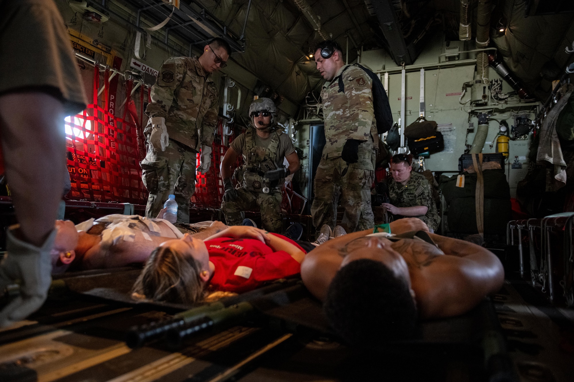 U.S. Air Force Airmen assigned to the 35th Operational Medical Readiness Squadron and 18th Aeromedical Rescue Squadron load simulated patients onto a U.S. Air Force C-130J Super Hercules for a bilateral aeromedical evacuation training event during exercise Resolute Force Pacific (REFORPAC) 2025.