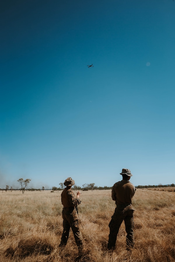 U.S. Marine Corps Cpl. Elah Heuschkel, left, and Lance Cpl. Exziriaun Williamson, both with Combat Logistics Battalion 1, Marine Rotational Force – Darwin 25.3, operate a Tactical Resupply Vehicle 150C unmanned aerial system during Talisman Sabre 25, in the Northern Territory, Australia, July 20, 2025. The TRV-150C enhances battlefield logistics and situational awareness by providing rapid, unmanned aerial resupply and reconnaissance capabilities in contested environments. Talisman Sabre is the largest bilateral military exercise between Australia and the United States advancing a free and open Indo-Pacific by strengthening relationships and interoperability among key allies and partners, while enhancing our collective capabilities to respond to a wide array of potential security concerns. Heuschkel is a native of Connecticut and Williamson a native of Ohio. (U.S. Marine Corps photo by Sgt. Brian A. Stippey)