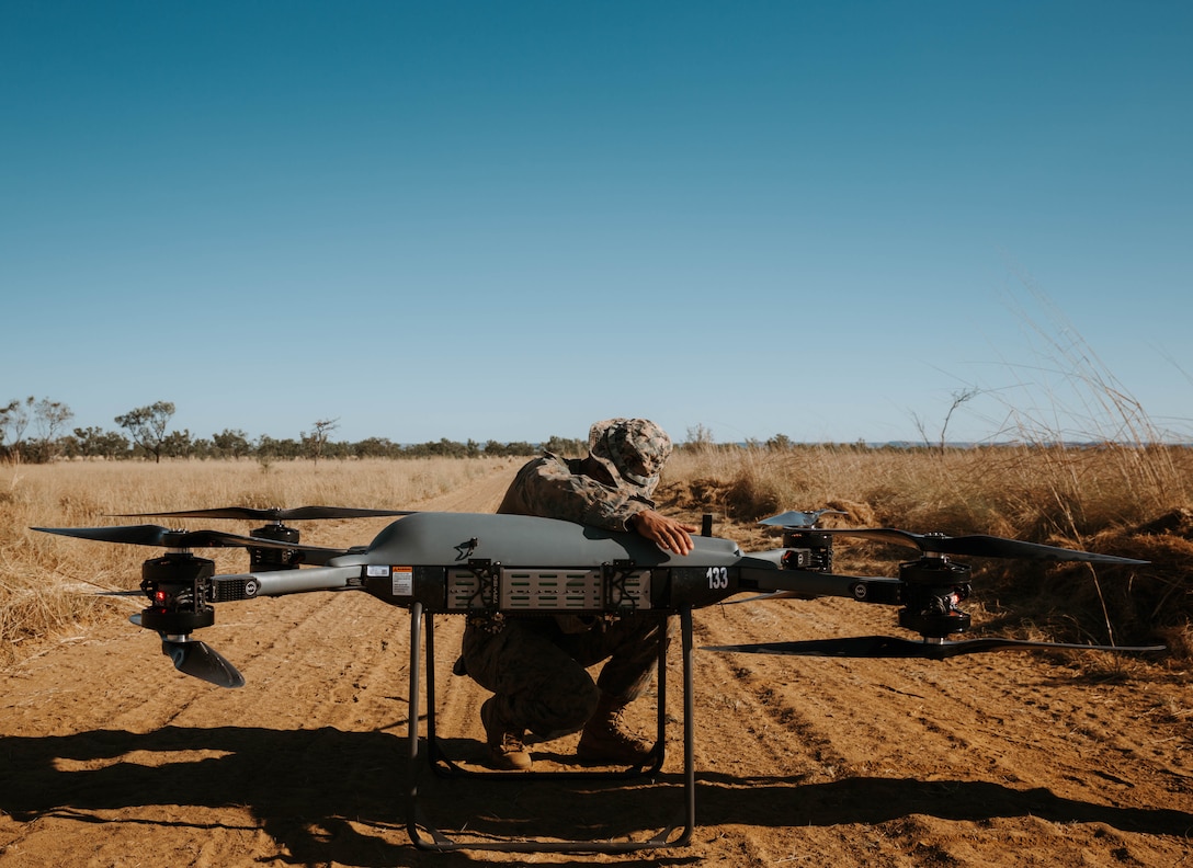 U.S. Marine Corps Lance Cpl. Exziriaun Williamson, assigned to Combat Logistics Battalion 1, Marine Rotational Force – Darwin 25.3, prepares a Tactical Resupply Vehicle 150C unmanned aerial system for launch during Talisman Sabre 25 in the Northern Territory, Australia, July 20, 2025. The TRV-150C enhances battlefield logistics and situational awareness by providing rapid, unmanned aerial resupply and reconnaissance capabilities in contested environments. Talisman Sabre is the largest bilateral military exercise between Australia and the United States advancing a free and open Indo-Pacific by strengthening relationships and interoperability among key allies and partners, while enhancing our collective capabilities to respond to a wide array of potential security concerns. Williamson is a native of Ohio.  (U.S. Marine Corps photo by Sgt. Brian A. Stippey)