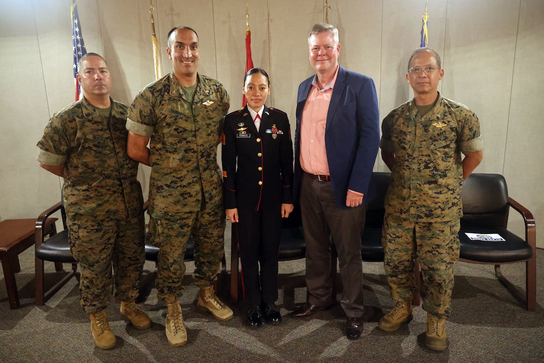 Philippine Marine Staff Sgt. Geraldine Corbita (center) poses with key leaders from I Marine Expeditionary Force and the Defense Health Network Pacific-Rim, including Master Chief Hospital Corpsman Michael Tabora (left), Capt. Brett Chamberlin (second to left), Cmdr. Rudy Medina (right), and Dr. John Rotruck, following her graduation from the U.S. Navy Independent Duty Corpsman School at the Surface Warfare Medical Institute (SWMI) in San Diego on July 11, 2025.