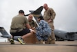 A U.S. Special Operations Forces Operator retrieves a cold chain blood resupply shipment from U.S. Army Sgt. 1st Class Eric Jimenez, medical logistics noncommissioned officer; Royal Australian Air Force Flt. Lt. Pooja Sapkota, scientific officer and pathology advisor, both with the Combined Joint Theatre Medical Component; and a member of the U.S. Air Force’s C-17 Globemaster crew, 535th Airlift Squadron, in Queensland, Australia, during Exercise Talisman Sabre 2025 on July 22, 2025.