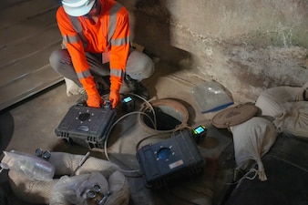 A Navy Closure Task Force-Red Hill (NCTF-RH) contractor conducts summa canister sampling during soil vapor monitoring at the Red Hill Bulk Fuel Storage Facility (RHBFSF) in Honolulu, July 8, 2025. This type of soil vapor monitoring analyzes vapors to detect individual volatile organic compounds that may be found in fuel. The ongoing monitoring efforts are part of the Navy’s enduring, long-term commitment to ensure the safety of the environment and public health. Charged with the safe decommissioning of the RHBFSF, NCTF-RH was established by the Department of the Navy as a commitment to the community and the environment. NCTF-RH continues to engage with the people of Hawaii, regulatory agencies, and other stakeholders as it safely and deliberately decommissions the facility. (U.S. Navy photo by Mass Communication Specialist 3rd Class Krystal Diaz)