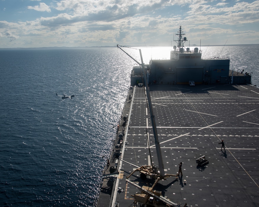 U.S. Military Sealift Command civil service mariners, assigned to the Lewis B. Puller-class expeditionary sea base USS John L. Canley (ESB 6) recover an Insitu Scan Eagle on the flight deck of the ship off the coast of Australia during Talisman Sabre, July 18, 2025.