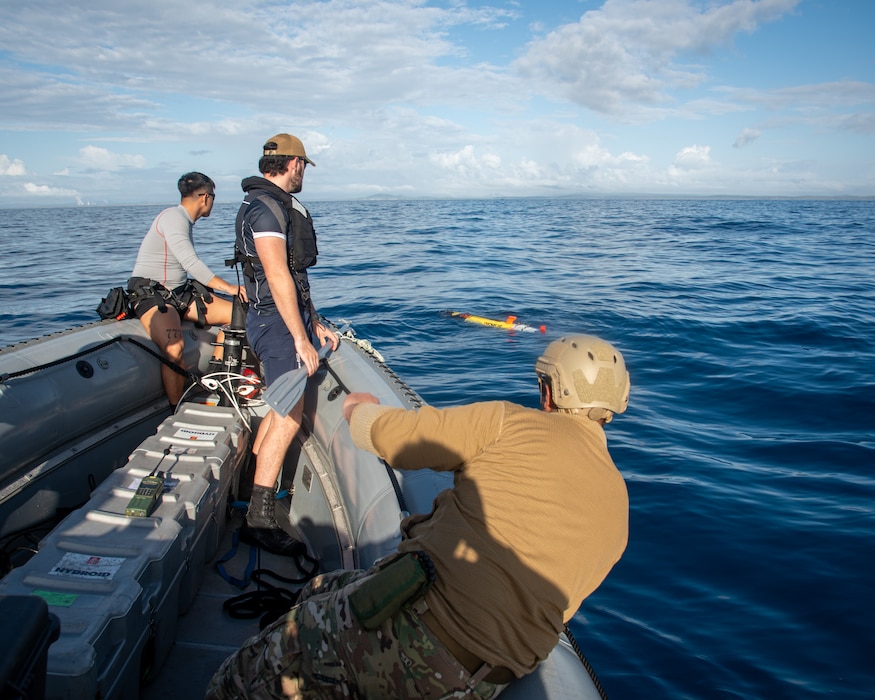 Royal New Zealand Navy Able Hydrographic System Operator Blake Todd, assigned to HMNZS Matataua, and U.S. Navy Robotics Warfare Specialist 2nd Class Roddrick Guerra, assigned to Explosive Ordnance Disposal Mobile Unit 5, launch a Remus 100 autonomous underwater vehicle from a rigid-hull inflatable boat assigned to the Lewis B. Puller-class expeditionary sea base USS John L. Canley (ESB 6) off the coast of Australia during Talisman Sabre, July 18, 2025.